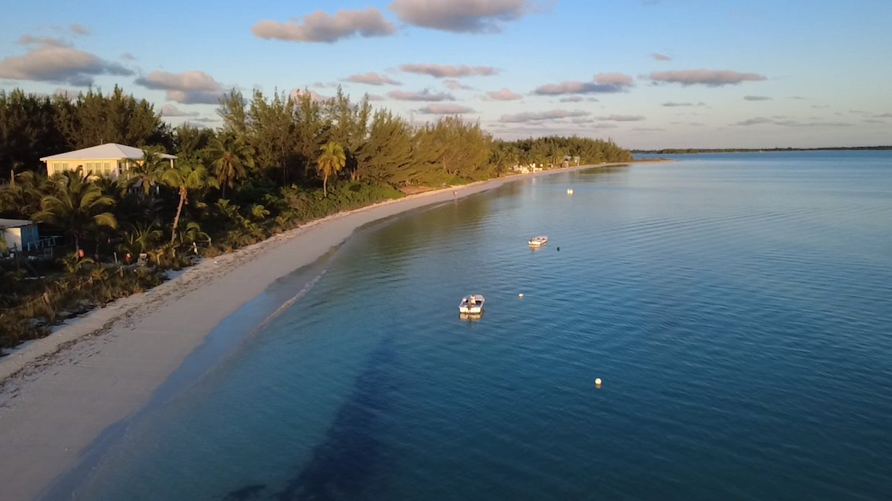 Aerial sunset view of oceanfront properties at Casuarina Point