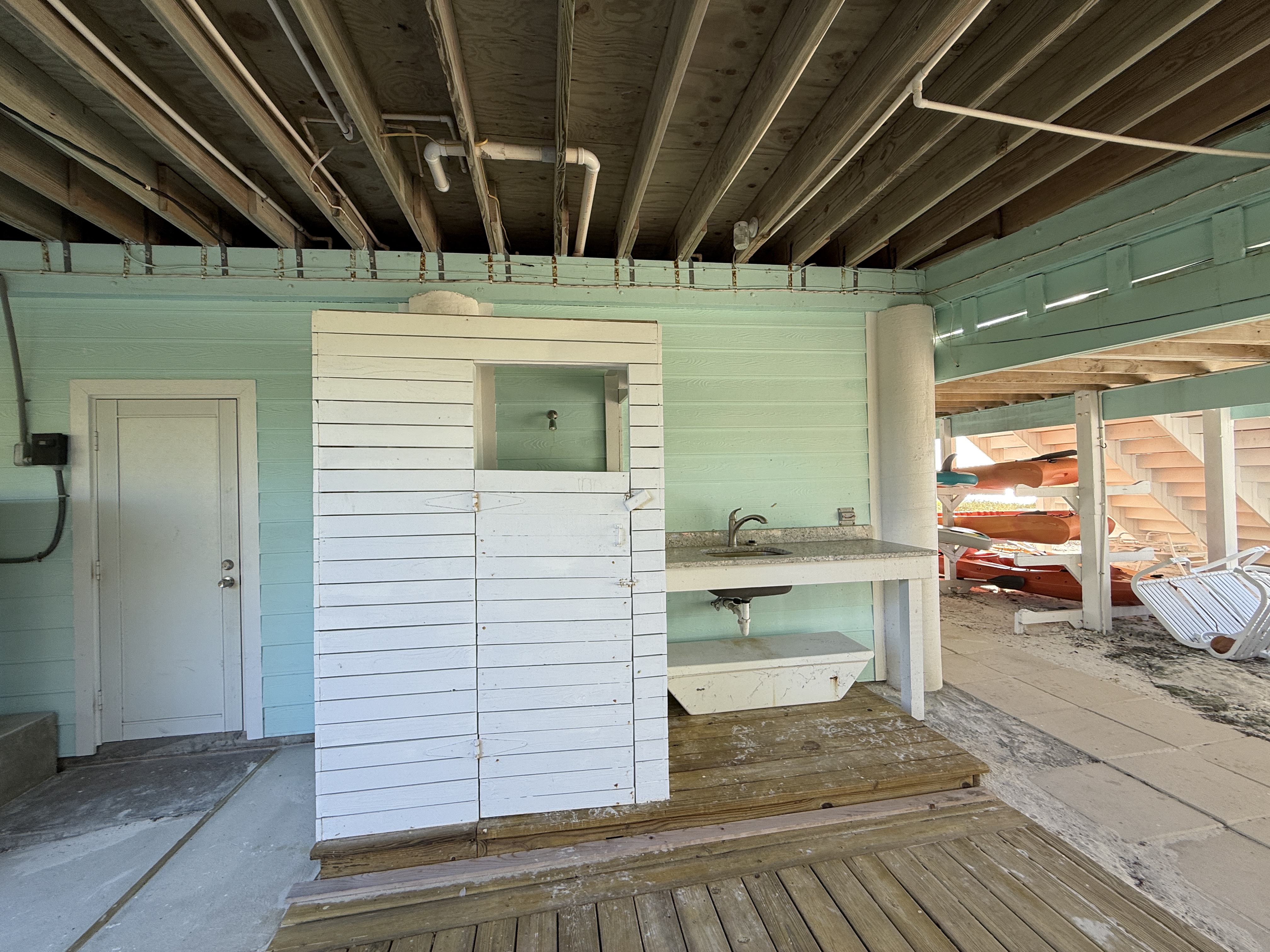 Beach level shower, sink with granite counter (for cleaning fish, etc.) and the door on the left is a water closet.  All convenient to the beach.