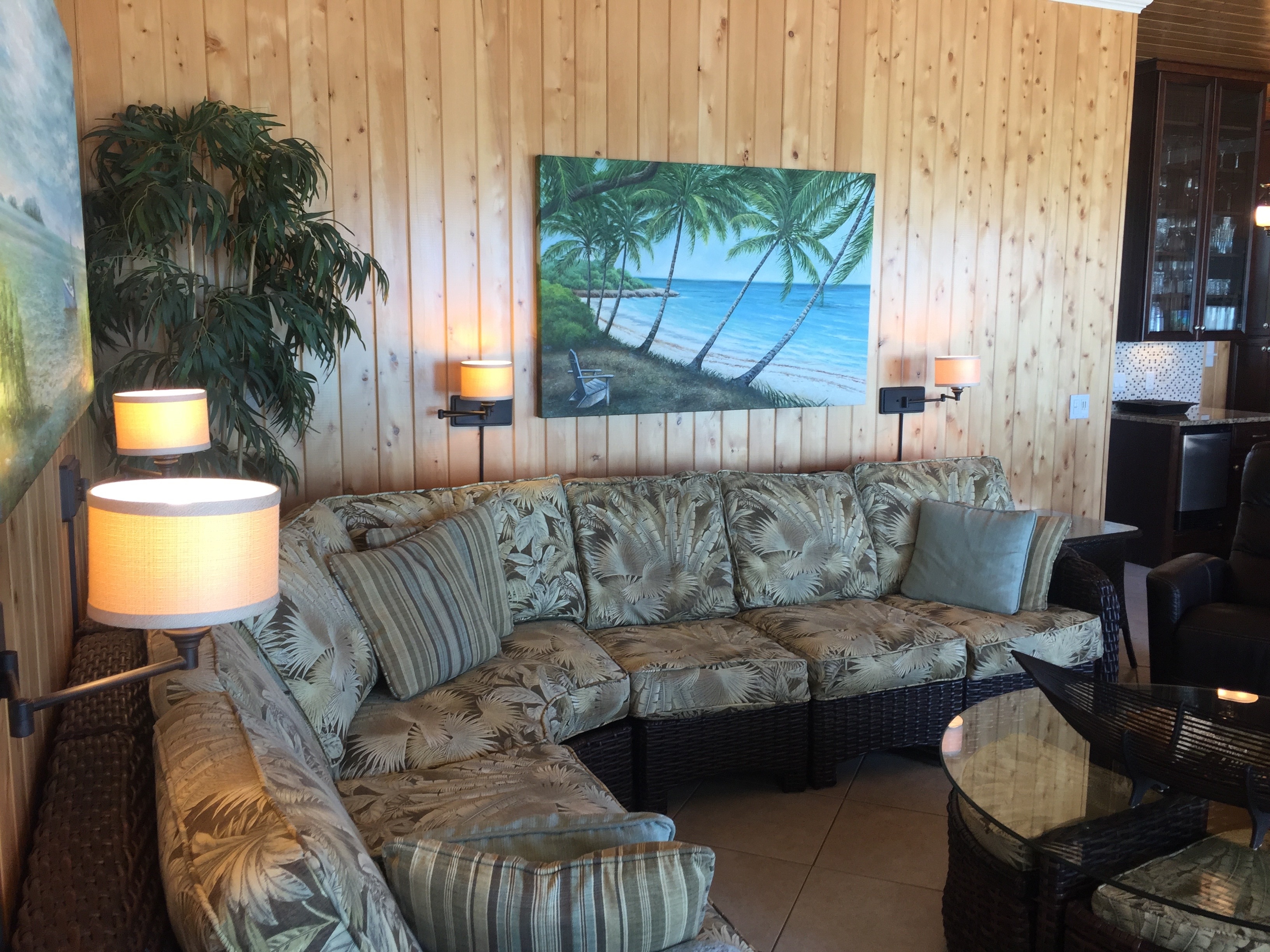 Large sectional sofa, 2 dining chairs, and 2 leather recliners provide ample seating in the living area.