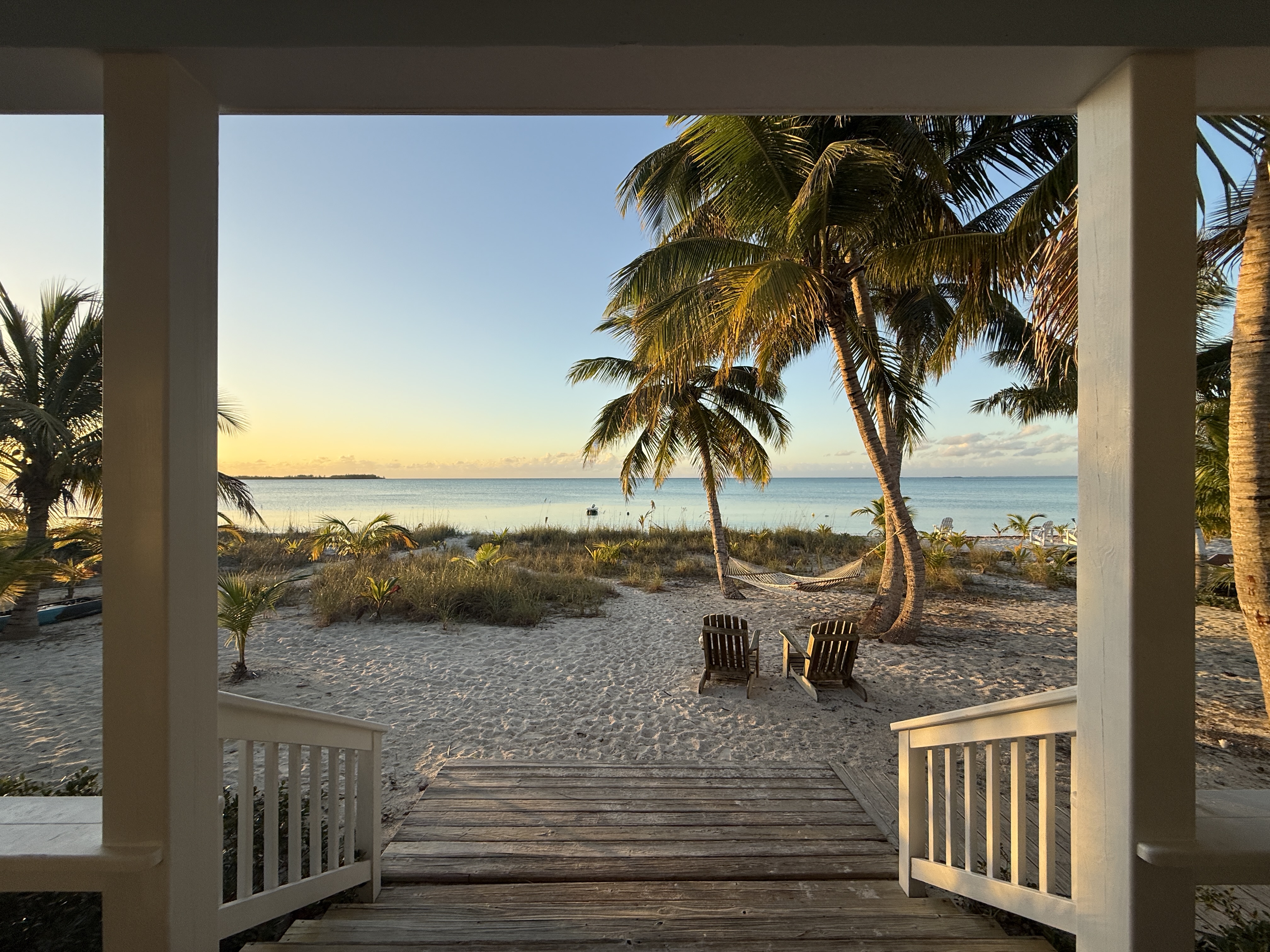 Four steps down to the beach and your Adirondack chairs and hammock