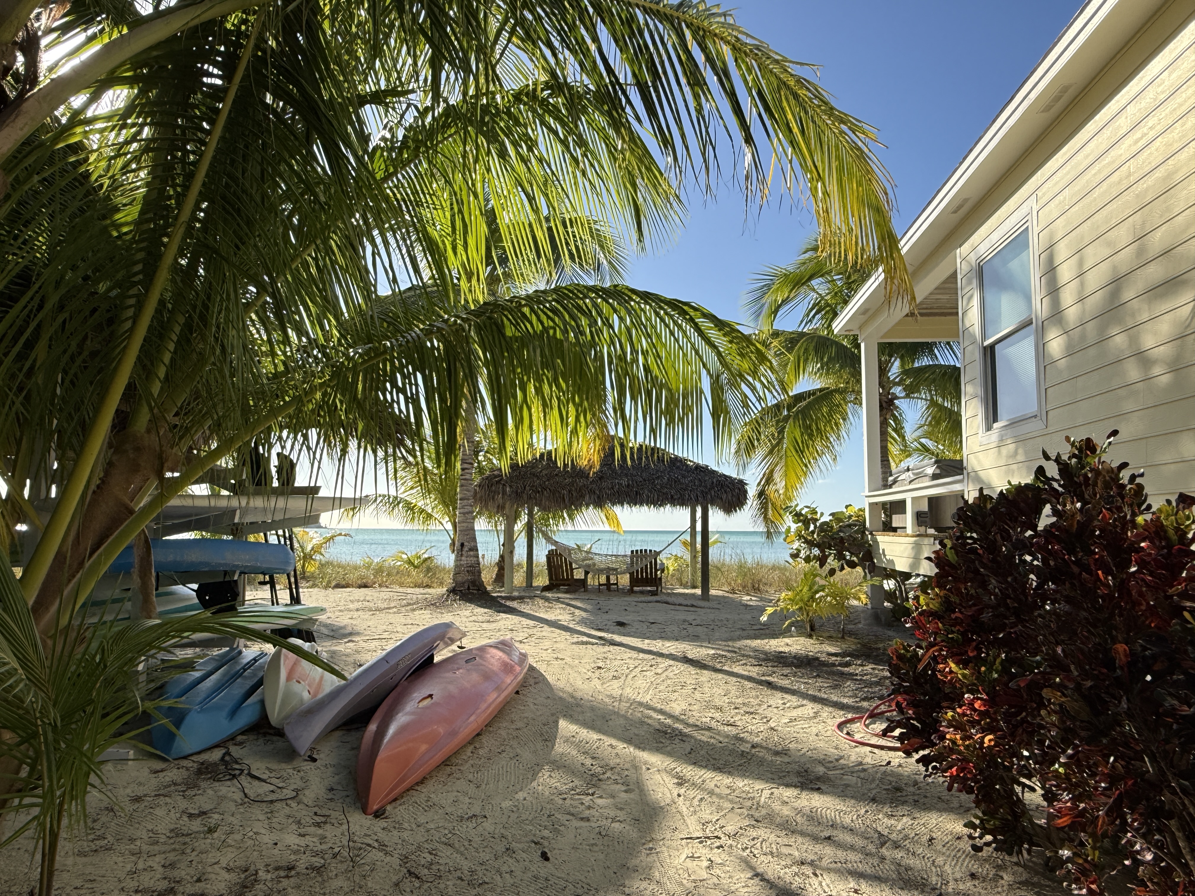 East side of Kokomo with paddle board/kayak rack and large Tiki Hut