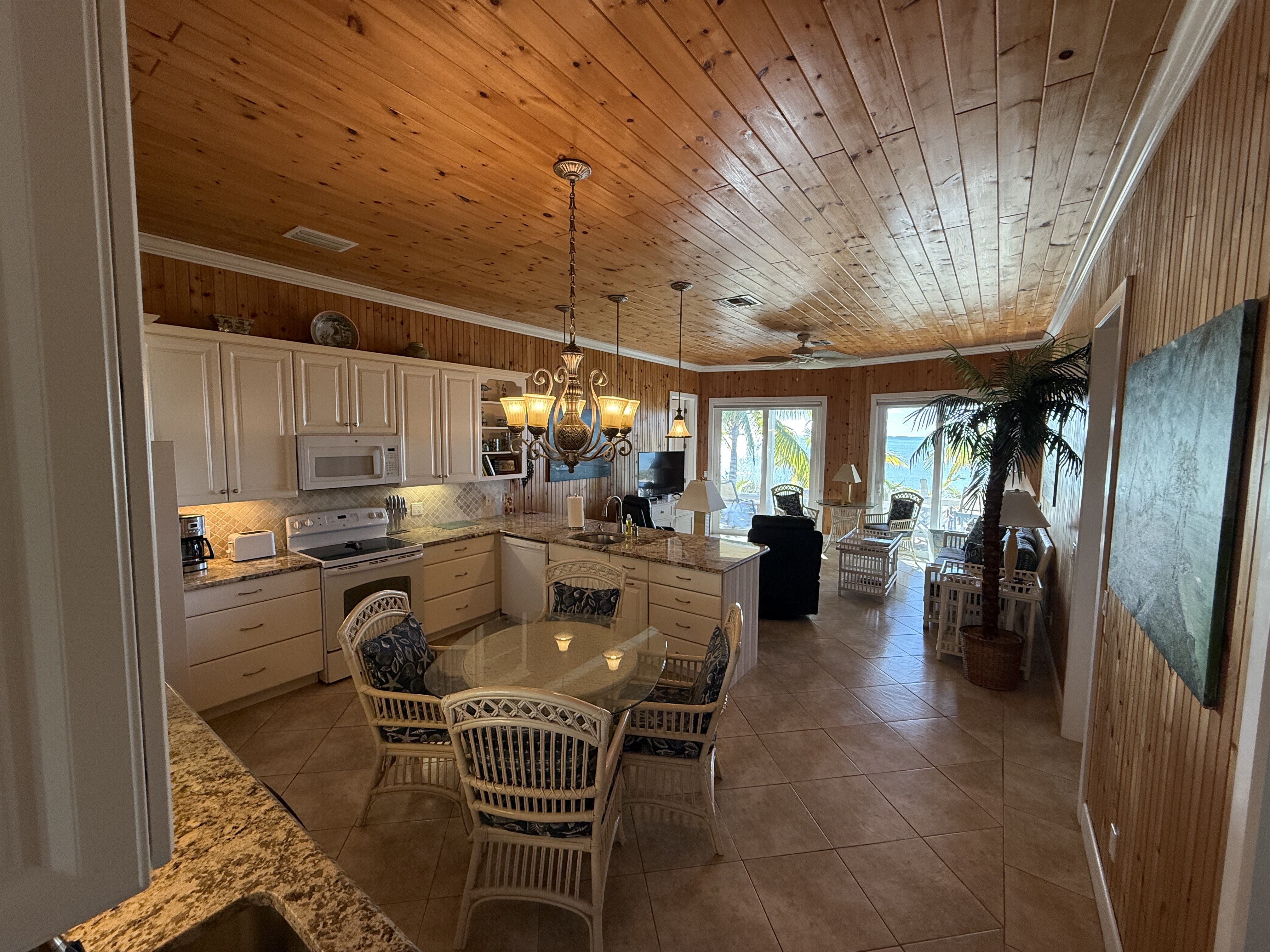 Open great room with kitchen & dining  - all with an ocean view