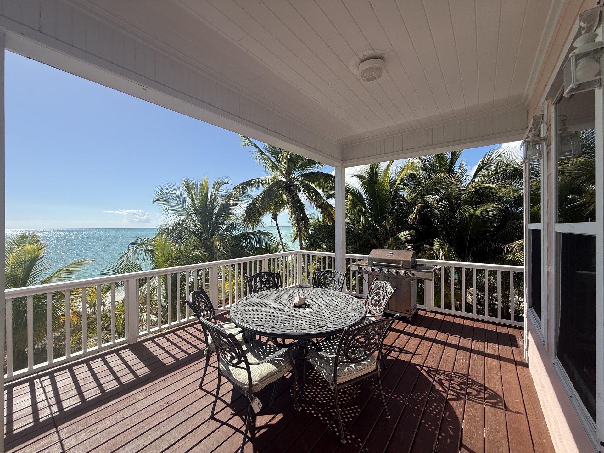 The spacious outdoor deck has a large dining table, gas grills and AMAZING views!
