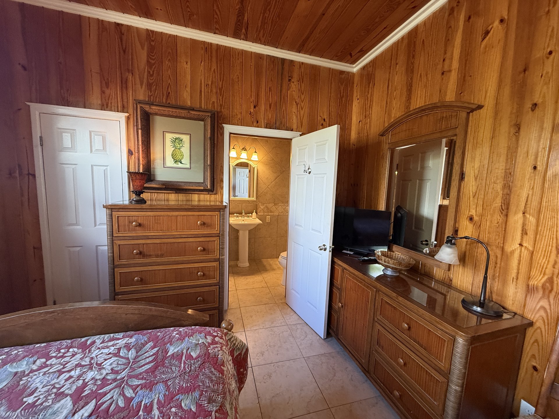 Queen Bedroom Downstairs with dresser and en-suite bath access