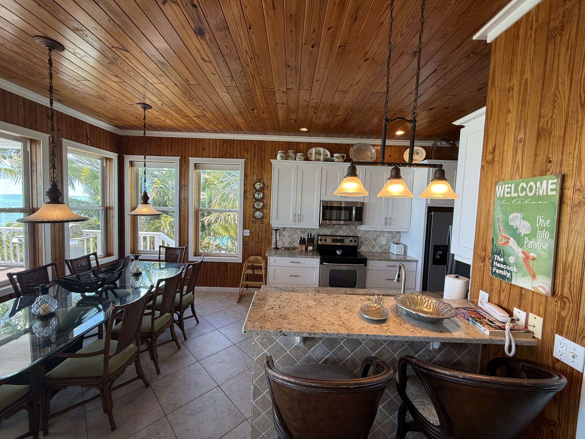 The kitchen & dining area of the great room - all with ocean views