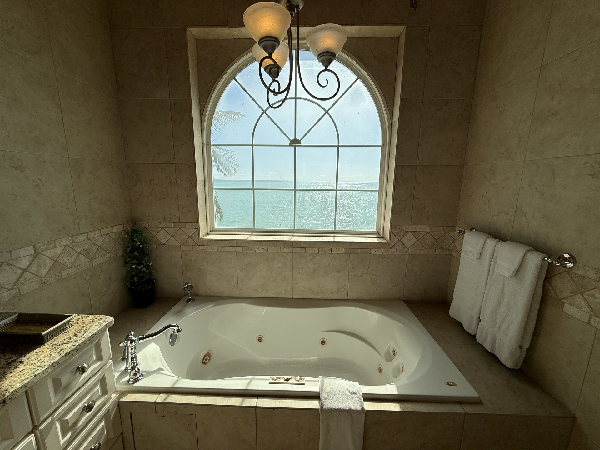 West Master Suite en-suite with large tub and ocean views