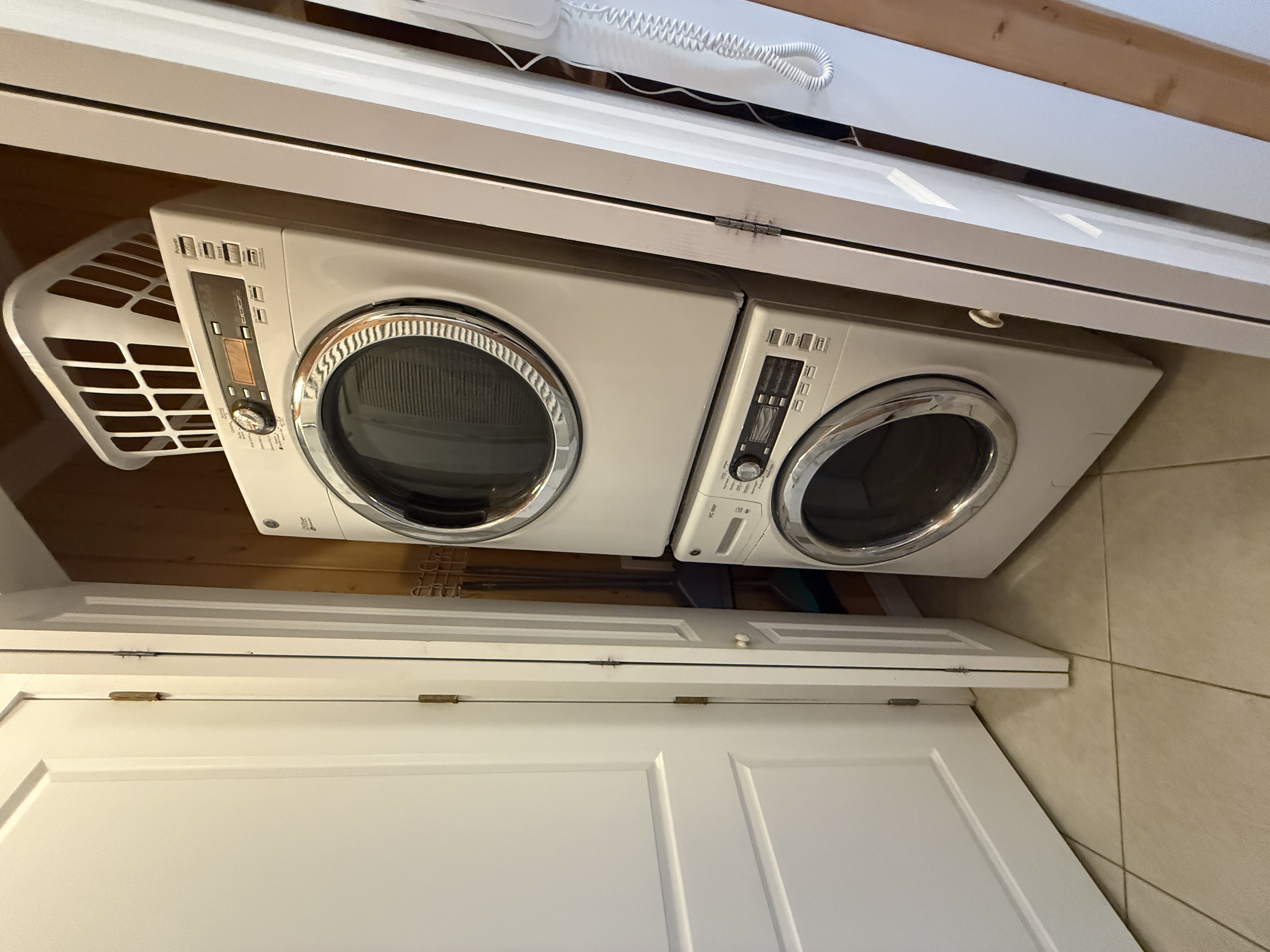 Stacking washer and dryer in hall Laundry Closet