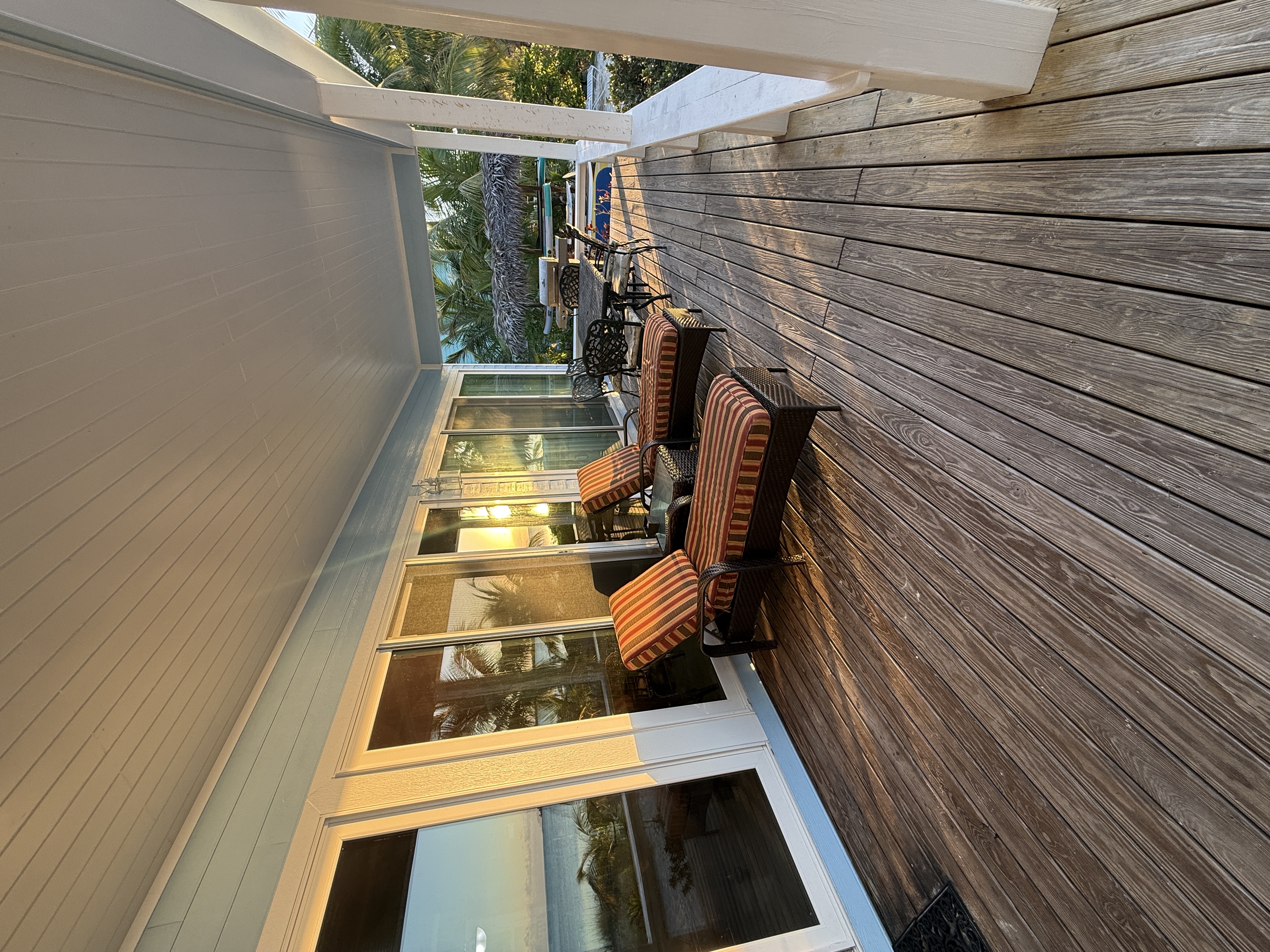 Large deck with lounge seating, dining table for 6, a gas grill and amazing ocean view