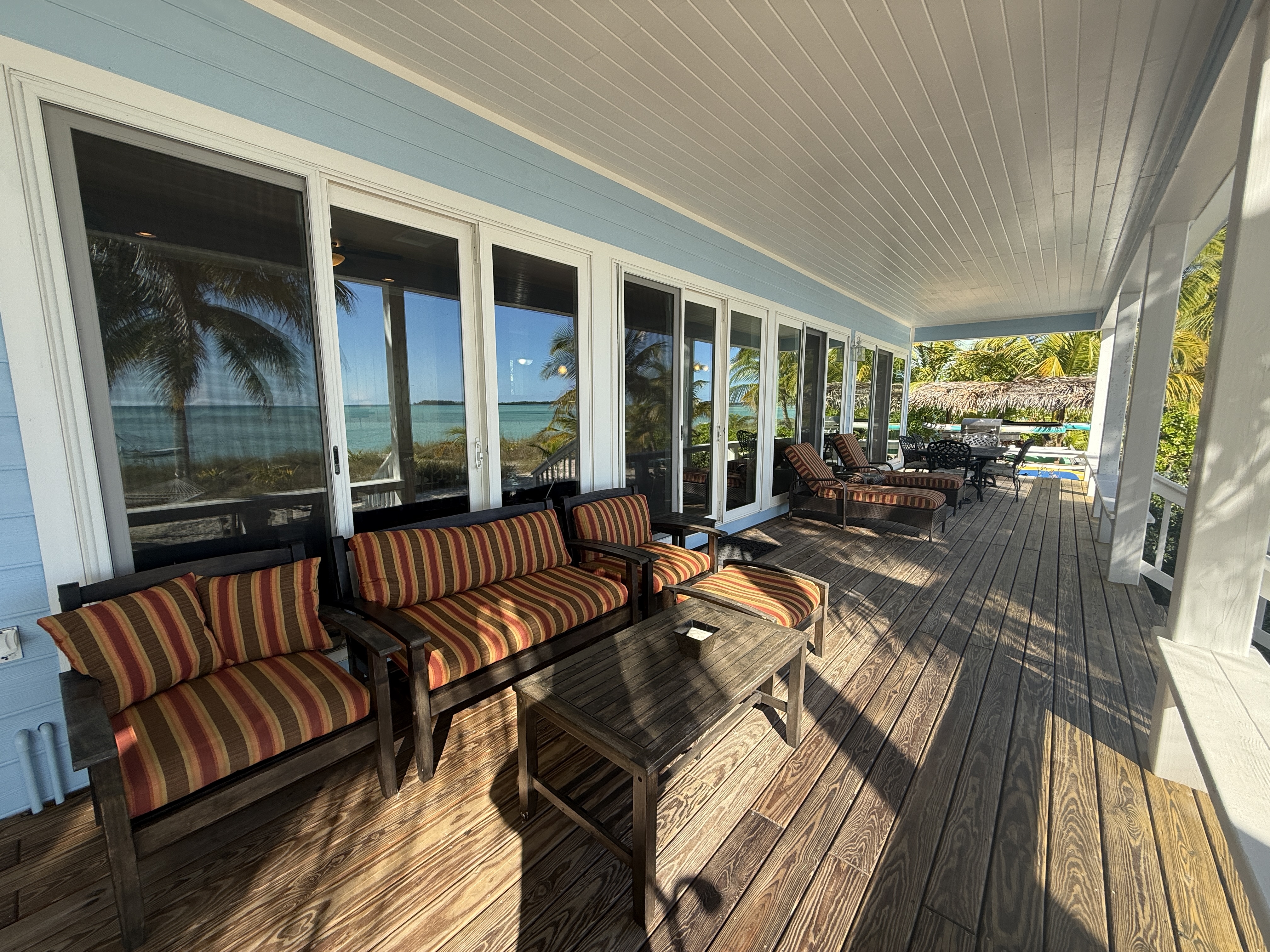 Comfortable seating on the deck with turquoise ocean views