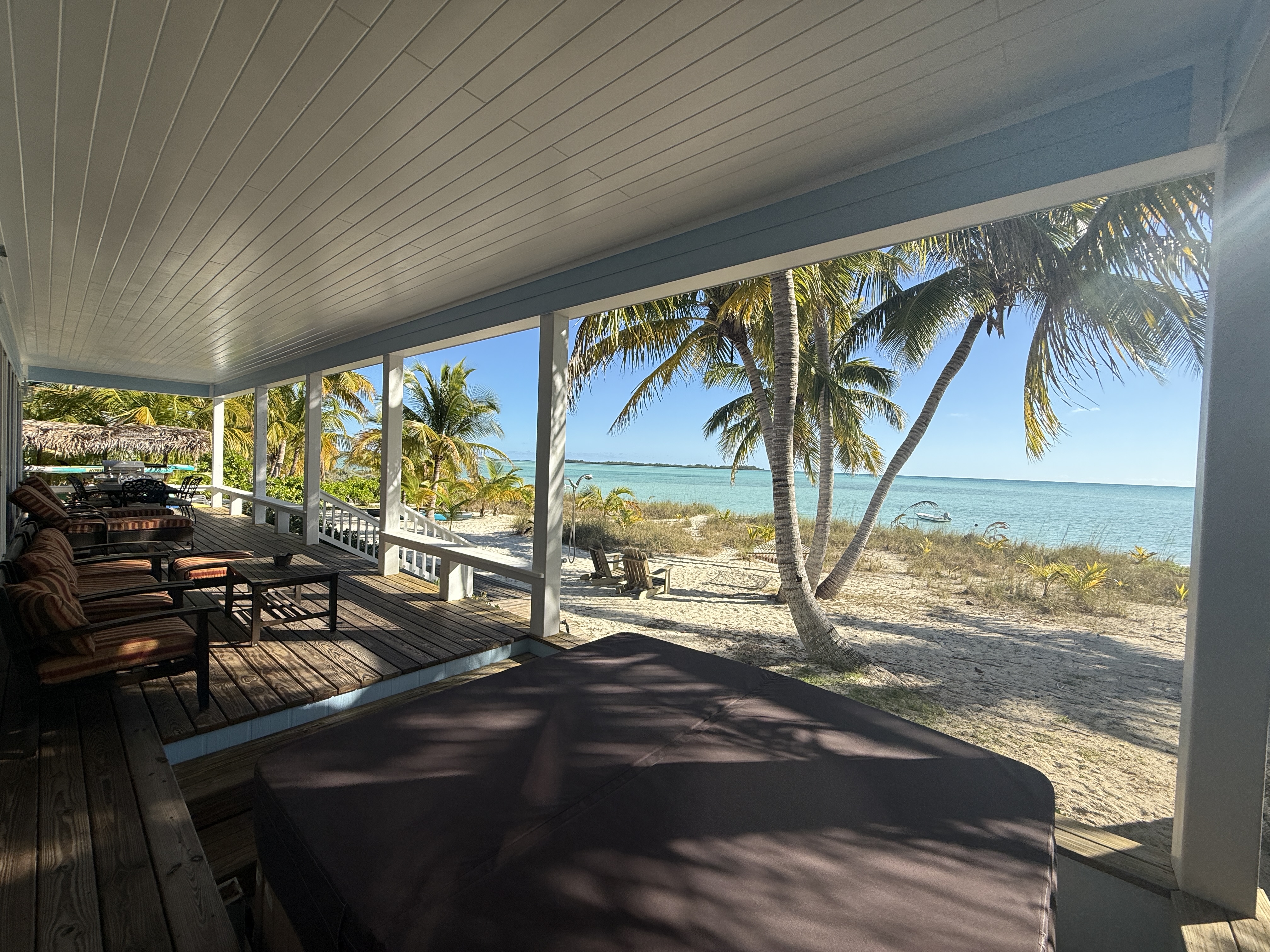 Covered deck with large hot tub - the perfect place to enjoy the view