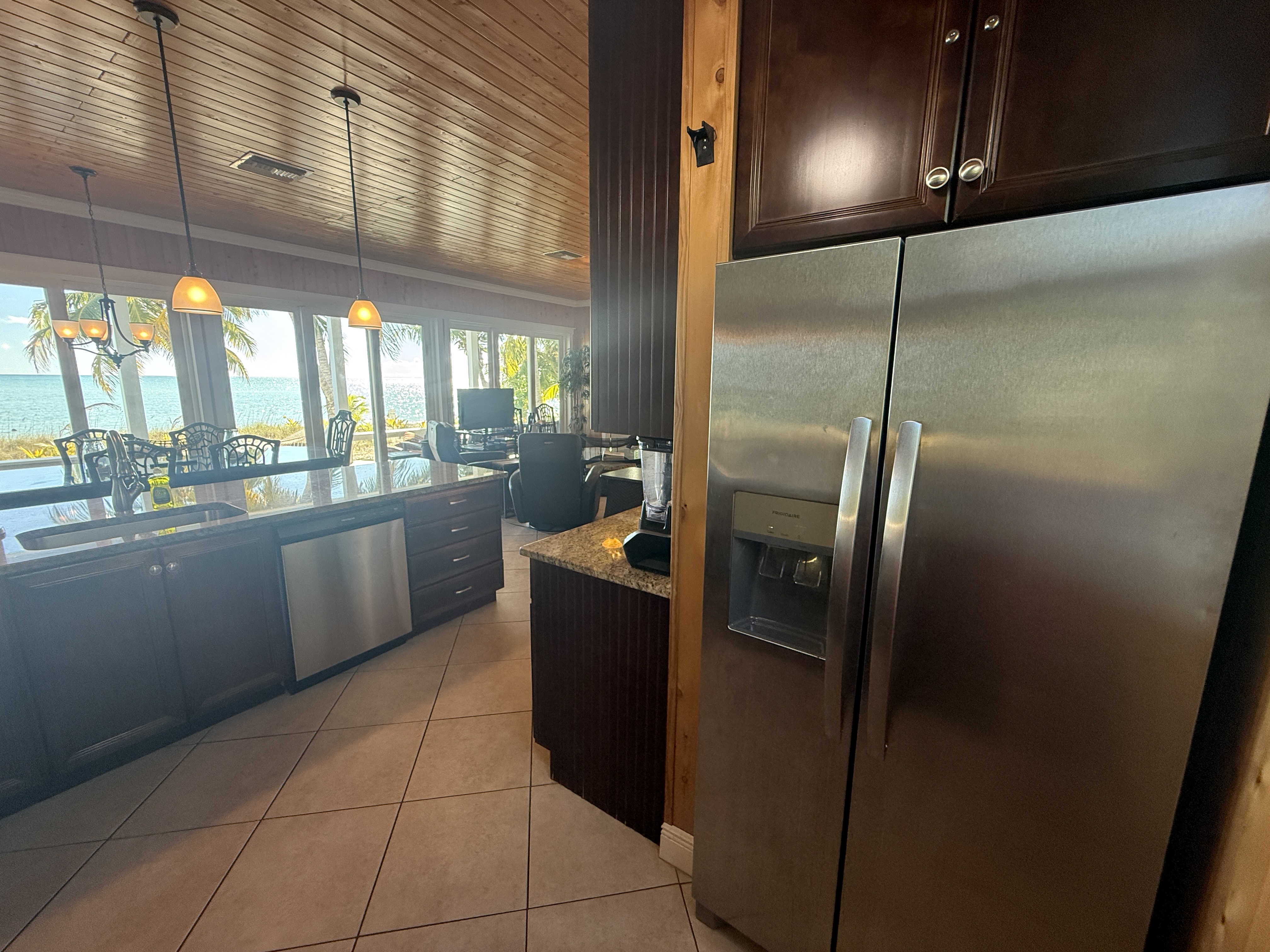 Kitchen with stainless appliances - full size refrigerator with ice maker and ocean view