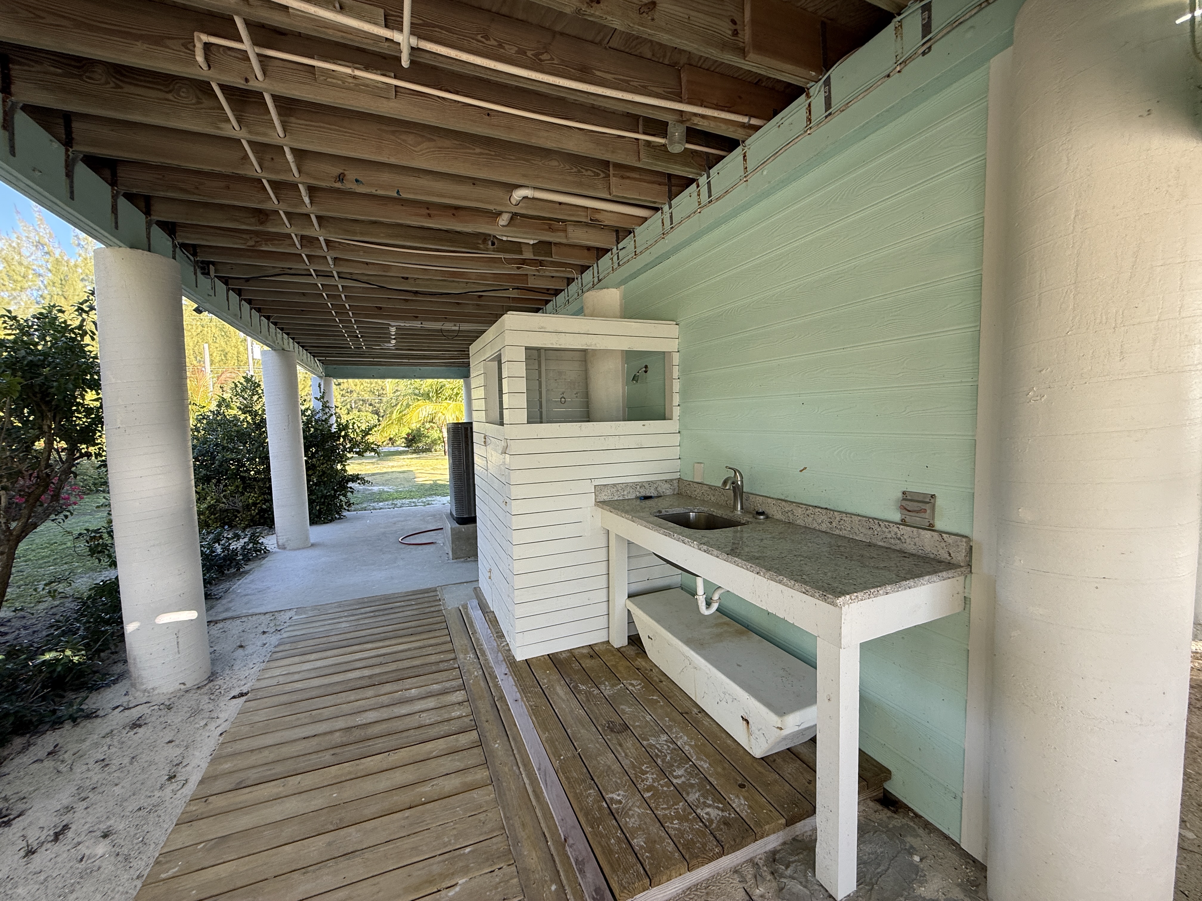 Beach level bathroom facilities - sink and semi-private enclosed shower