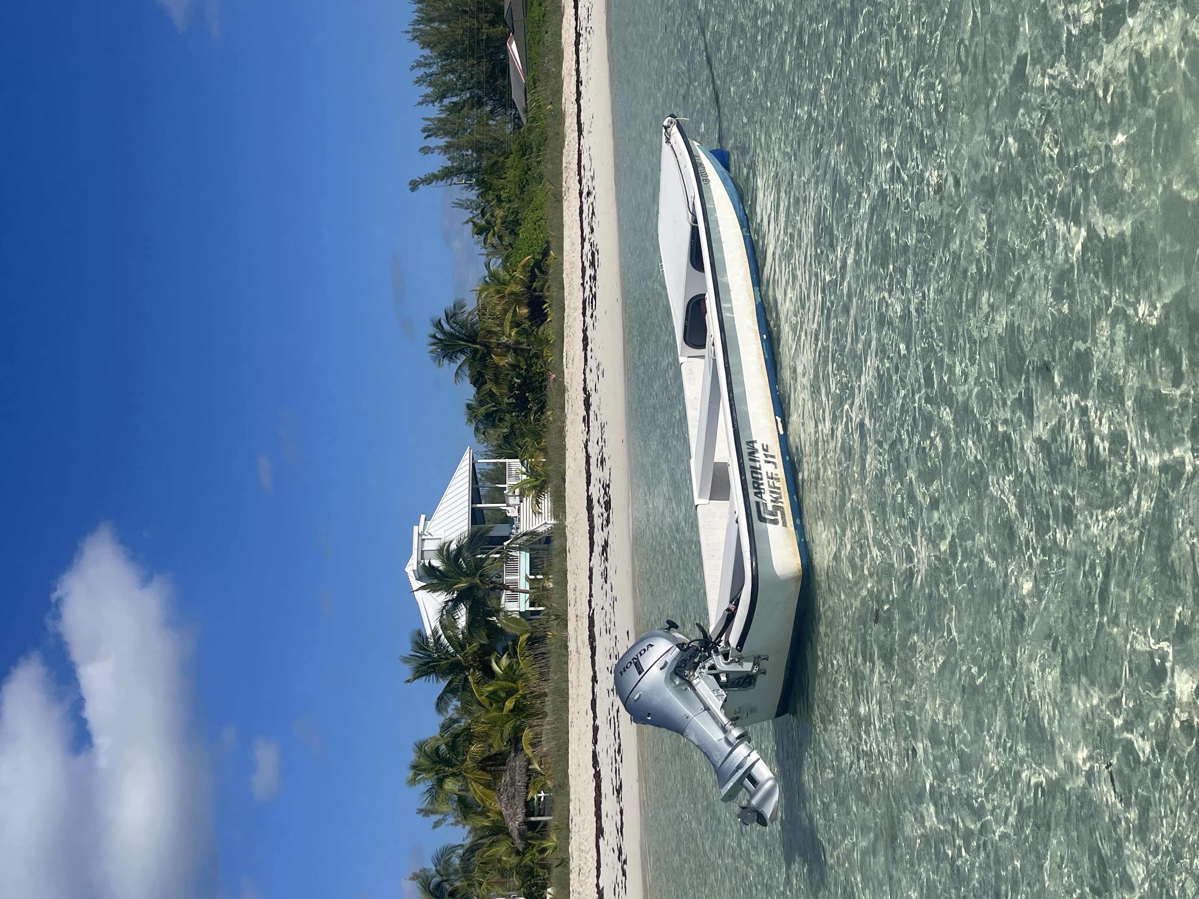Calypso with the 16' Carolina Skiff moored in front