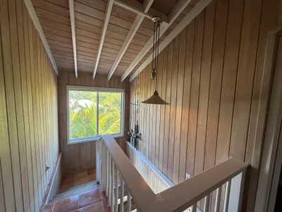 Stairway to the top floor bedrooms and bath