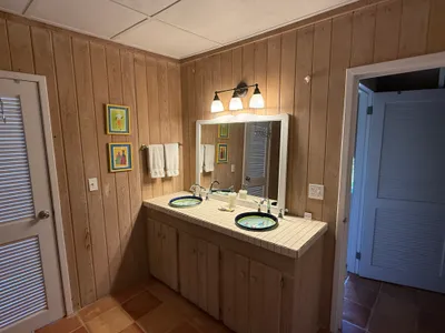 Upstairs en-suite vanity with double ceramic sinks