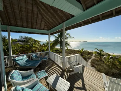 Beachfront covered deck with comfortable seating an spectacular ocean view