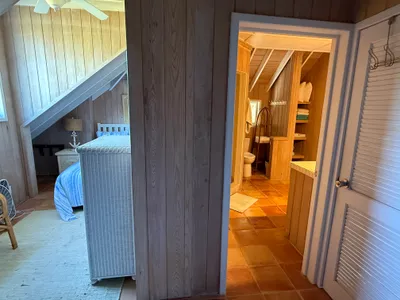 Just outside the bedroom with the 2 full beds is the door to the top floor bathroom.