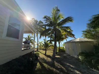West side of Kokomo & storage house with boat gas, extra propane, and beach toys