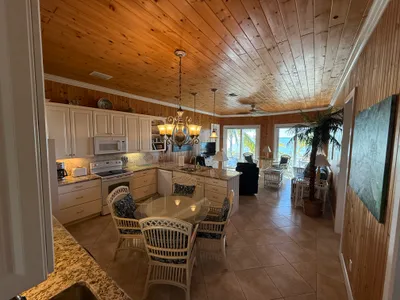 Open great room with kitchen & dining  - all with an ocean view