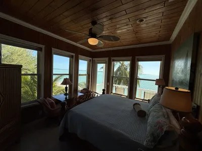 East Master Suite corner windows with wrap-around Atlantic views