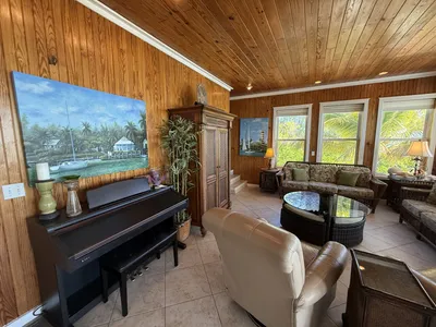 Living room with digital piano and comfortable seating