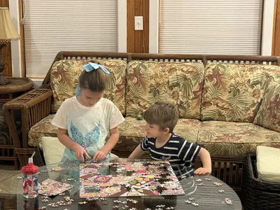 The coffee table with rolling ottomans makes a great place for games and puzzles
