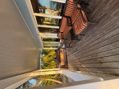 Large covered deck with sunken Vita Spa hot tub