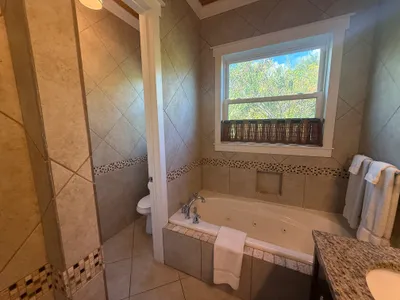 East Master with large tub and separate water closet