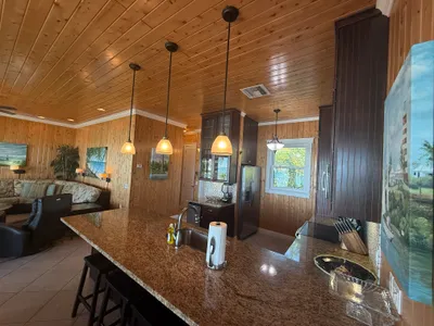 Kitchen with large granite counter and custom cabinets