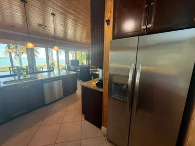 Kitchen with stainless appliances - full size refrigerator with ice maker and ocean view