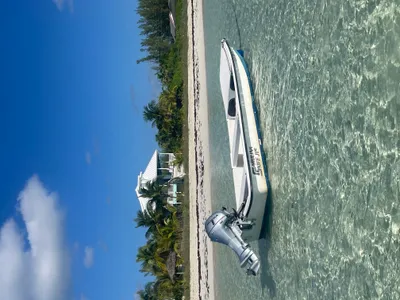 Calypso with the 16' Carolina Skiff moored in front